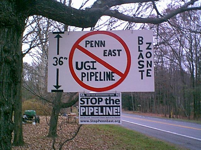 Bill Kellner constructed & posted the sign on his property on Rte. 209 in Towamensing. The Penn East projected blast zone for a 36 inch pipe under 1480 psi is 900 ft in all directions. (Photo: Stop The Fracking Pipeline-A Project of Save Carbon County)