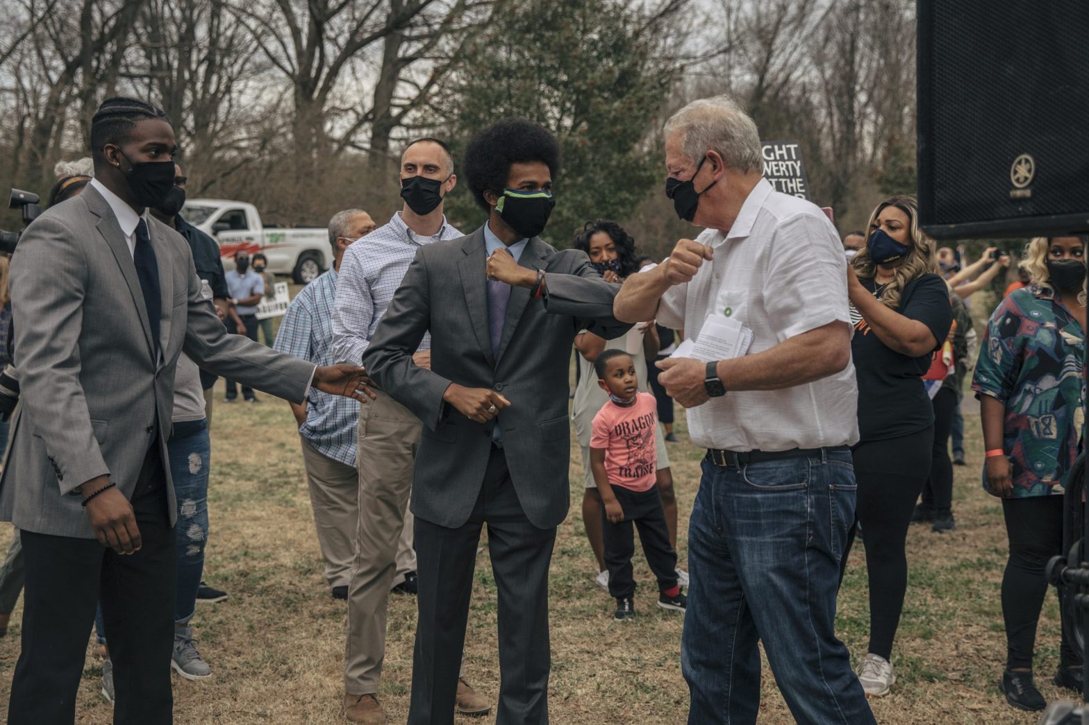 Justin J. Pearson, an organizer Memphis Community Against the Pipeline bumps elbows with former Vice President Al Gore after his speech during a rally organized by MCAP at Alonzo Weaver Park on Sunday afternoon. (Photo: Andrea Morales for MLK50)