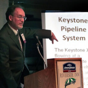 Photo of Paul Blackburn giving a presentation on Keystone Pipeline System.