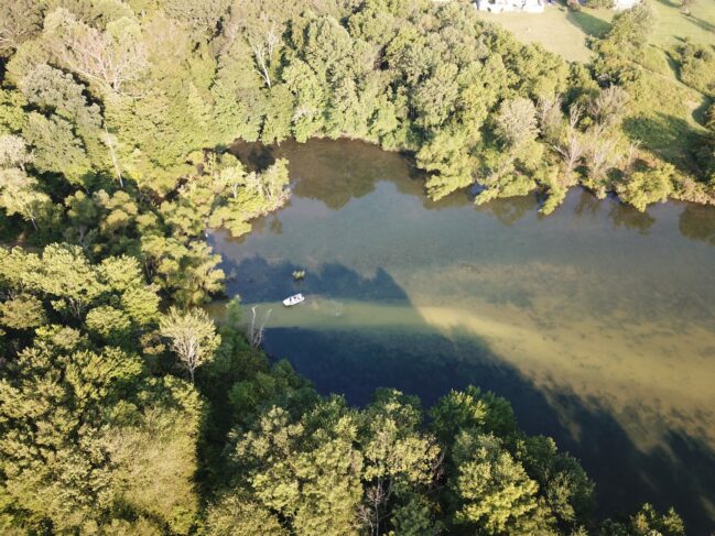 An aerial shot of Marsh Creek Lake in Chester County shows muddy water where drilling mud has leaked from pipeline construction. (Photo: Chris DeGiulio / StateImpact PA)